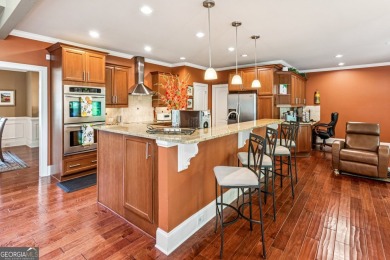 Welcome to Traditions of Braselton, enjoy a beautiful drive thru on Traditions of Braselton Golf Club in Georgia - for sale on GolfHomes.com, golf home, golf lot