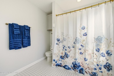 Nestled in the highly desirable Hunting Creek, this beautifully on Hunting Creek Country Club in Kentucky - for sale on GolfHomes.com, golf home, golf lot