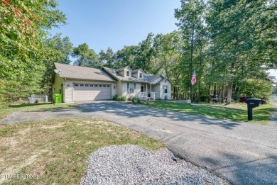 Step into this beautifully maintained 3-bedroom, 2-bathroom home on Lake Tansi Village Country Club in Tennessee - for sale on GolfHomes.com, golf home, golf lot