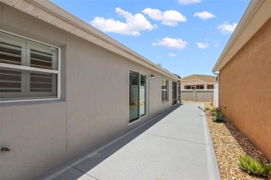 ABSOLUTELY STUNNING 3/2 BLOCK and STUCCO Foxglove courtyard on The Links of Spruce Creek in Florida - for sale on GolfHomes.com, golf home, golf lot
