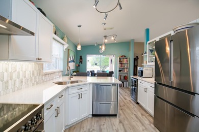 Gorgeously remodeled lakefront home with over $84,000 in on Spanish Lakes Fairways in Florida - for sale on GolfHomes.com, golf home, golf lot