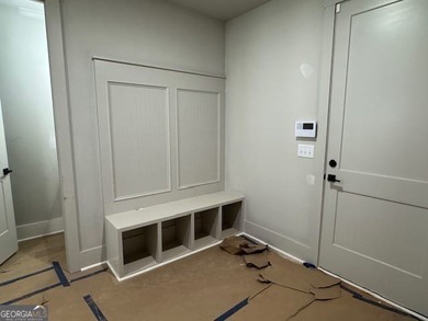 Luxury living awaits in River Forest, a premier swim, golf, and on The Club River Forest in Georgia - for sale on GolfHomes.com, golf home, golf lot