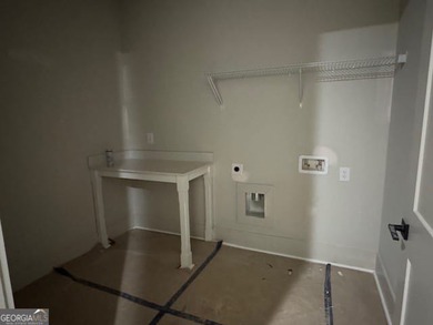 Luxury living awaits in River Forest, a premier swim, golf, and on The Club River Forest in Georgia - for sale on GolfHomes.com, golf home, golf lot