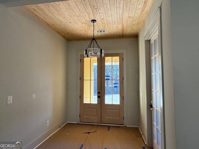 Luxury living awaits in River Forest, a premier swim, golf, and on The Club River Forest in Georgia - for sale on GolfHomes.com, golf home, golf lot