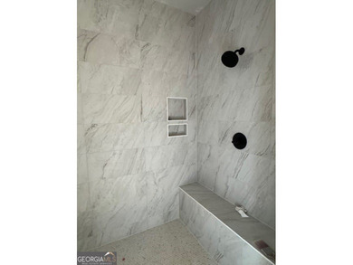 Luxury living awaits in River Forest, a premier swim, golf, and on The Club River Forest in Georgia - for sale on GolfHomes.com, golf home, golf lot