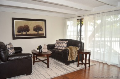 This 2 bedroom 2 bath condo lives LARGE with approximately 1,250 on Seasons Ridge At Four Seasons in Missouri - for sale on GolfHomes.com, golf home, golf lot