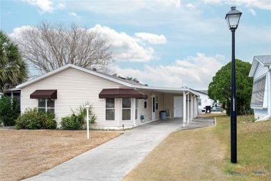 Welcome to this charming 2 bedroom 2 bathroom site built home on Lakes of Lady Lake Golf Course in Florida - for sale on GolfHomes.com, golf home, golf lot