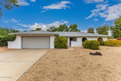 Open and bright living spaces flow from the crisp white kitchen on Gainey Ranch Golf Club in Arizona - for sale on GolfHomes.com, golf home, golf lot