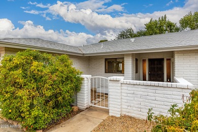 Open and bright living spaces flow from the crisp white kitchen on Gainey Ranch Golf Club in Arizona - for sale on GolfHomes.com, golf home, golf lot