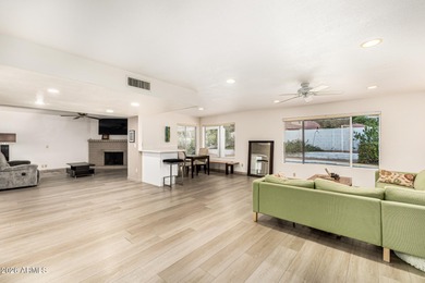 Open and bright living spaces flow from the crisp white kitchen on Gainey Ranch Golf Club in Arizona - for sale on GolfHomes.com, golf home, golf lot