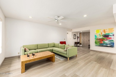Open and bright living spaces flow from the crisp white kitchen on Gainey Ranch Golf Club in Arizona - for sale on GolfHomes.com, golf home, golf lot
