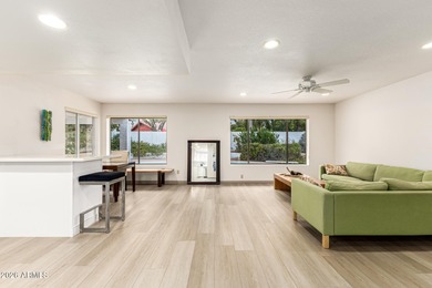 Open and bright living spaces flow from the crisp white kitchen on Gainey Ranch Golf Club in Arizona - for sale on GolfHomes.com, golf home, golf lot