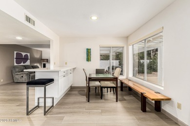 Open and bright living spaces flow from the crisp white kitchen on Gainey Ranch Golf Club in Arizona - for sale on GolfHomes.com, golf home, golf lot