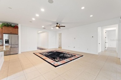 Beautiful 3 bedroom home with with 2 1/2 baths and den. This on Stonegate Golf Club in Florida - for sale on GolfHomes.com, golf home, golf lot