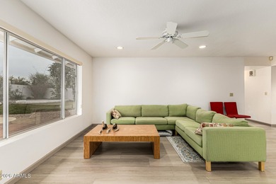 Open and bright living spaces flow from the crisp white kitchen on Gainey Ranch Golf Club in Arizona - for sale on GolfHomes.com, golf home, golf lot