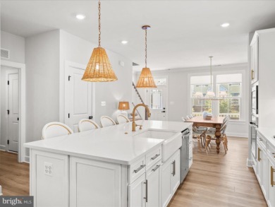 Welcome to 22179 Dune Circle, a stunning end-unit townhome in on The Peninsula Golf and Country Club in Delaware - for sale on GolfHomes.com, golf home, golf lot