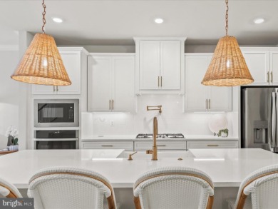 Welcome to 22179 Dune Circle, a stunning end-unit townhome in on The Peninsula Golf and Country Club in Delaware - for sale on GolfHomes.com, golf home, golf lot