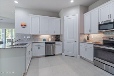 Welcome to your MAINTENANCE-FREE Townhome in the incredible on Plantation Bay Golf and Country Club in Florida - for sale on GolfHomes.com, golf home, golf lot