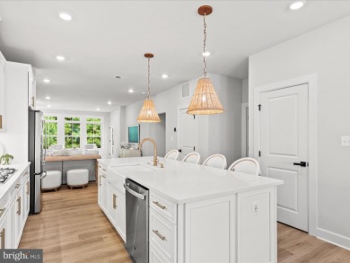 Welcome to 22179 Dune Circle, a stunning end-unit townhome in on The Peninsula Golf and Country Club in Delaware - for sale on GolfHomes.com, golf home, golf lot