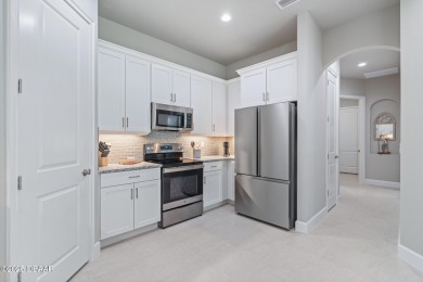 Welcome to your MAINTENANCE-FREE Townhome in the incredible on Plantation Bay Golf and Country Club in Florida - for sale on GolfHomes.com, golf home, golf lot