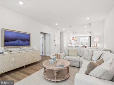 Welcome to 22179 Dune Circle, a stunning end-unit townhome in on The Peninsula Golf and Country Club in Delaware - for sale on GolfHomes.com, golf home, golf lot