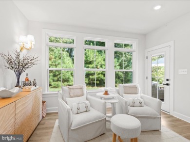 Welcome to 22179 Dune Circle, a stunning end-unit townhome in on The Peninsula Golf and Country Club in Delaware - for sale on GolfHomes.com, golf home, golf lot