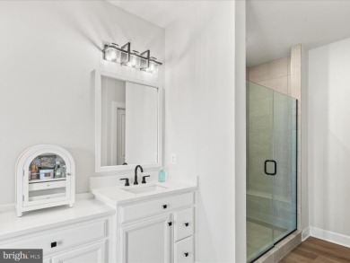 Welcome to 22179 Dune Circle, a stunning end-unit townhome in on The Peninsula Golf and Country Club in Delaware - for sale on GolfHomes.com, golf home, golf lot