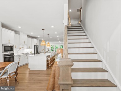 Welcome to 22179 Dune Circle, a stunning end-unit townhome in on The Peninsula Golf and Country Club in Delaware - for sale on GolfHomes.com, golf home, golf lot