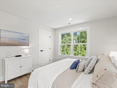 Welcome to 22179 Dune Circle, a stunning end-unit townhome in on The Peninsula Golf and Country Club in Delaware - for sale on GolfHomes.com, golf home, golf lot