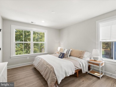 Welcome to 22179 Dune Circle, a stunning end-unit townhome in on The Peninsula Golf and Country Club in Delaware - for sale on GolfHomes.com, golf home, golf lot