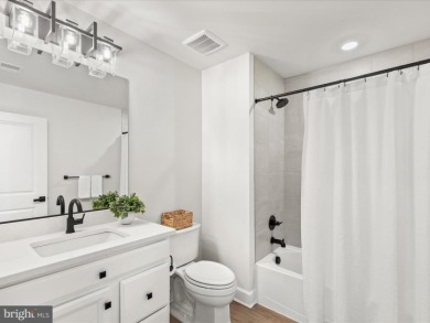Welcome to 22179 Dune Circle, a stunning end-unit townhome in on The Peninsula Golf and Country Club in Delaware - for sale on GolfHomes.com, golf home, golf lot