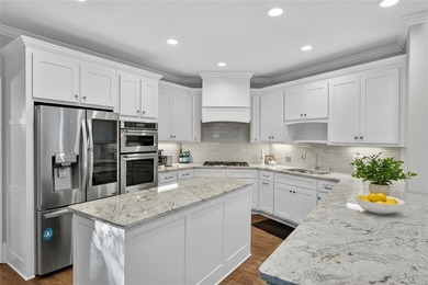 Welcome to your dream home on a quiet cul-de-sac, backing up to on The Golf Club of Georgia in Georgia - for sale on GolfHomes.com, golf home, golf lot