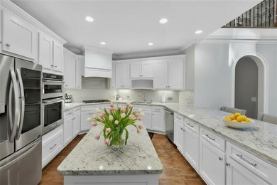 Welcome to your dream home on a quiet cul-de-sac, backing up to on The Golf Club of Georgia in Georgia - for sale on GolfHomes.com, golf home, golf lot