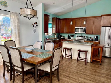 Experience relaxed coastal living in this updated 3-bedroom on Ocean Palm Golf Course in Florida - for sale on GolfHomes.com, golf home, golf lot