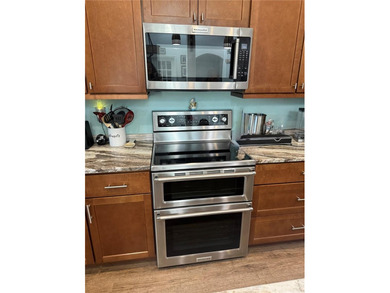 Experience relaxed coastal living in this updated 3-bedroom on Ocean Palm Golf Course in Florida - for sale on GolfHomes.com, golf home, golf lot