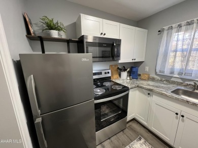 Perfect end unit and successful rental.  Turnkey 1st floor on Blue Knob Rec Area Golf Course in Pennsylvania - for sale on GolfHomes.com, golf home, golf lot