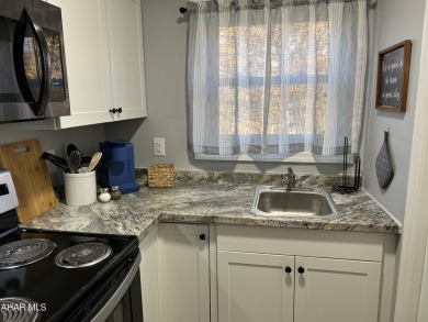 Perfect end unit and successful rental.  Turnkey 1st floor on Blue Knob Rec Area Golf Course in Pennsylvania - for sale on GolfHomes.com, golf home, golf lot