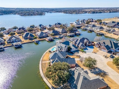Water's Edge perfection with 132 ft of water frontage on a quiet on Harbor Lakes Golf Club in Texas - for sale on GolfHomes.com, golf home, golf lot