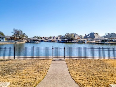 Water's Edge perfection with 132 ft of water frontage on a quiet on Harbor Lakes Golf Club in Texas - for sale on GolfHomes.com, golf home, golf lot