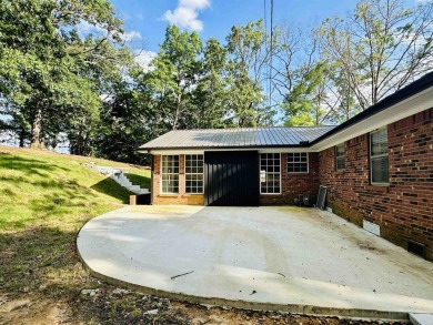 Experience luxury living in this completely remodeled 4-bedroom on Selmer Golf and Country Club in Tennessee - for sale on GolfHomes.com, golf home, golf lot