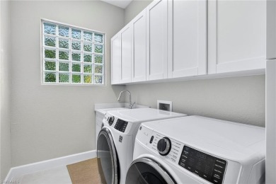 Discover the pinnacle of luxury living in this beautifully on West Bay Beach and Golf Club in Florida - for sale on GolfHomes.com, golf home, golf lot