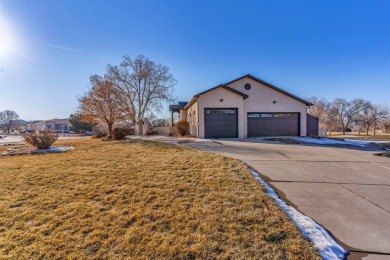 Enter this lovely home through the private courtyard to the on Desert Hawk At Pueblo West in Colorado - for sale on GolfHomes.com, golf home, golf lot