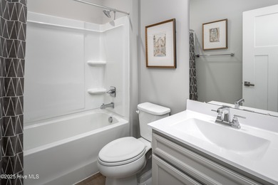 Step into style and comfort with this beautifully designed ranch on Sea Trail Golf Resort in North Carolina - for sale on GolfHomes.com, golf home, golf lot