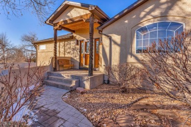 Enter this lovely home through the private courtyard to the on Desert Hawk At Pueblo West in Colorado - for sale on GolfHomes.com, golf home, golf lot