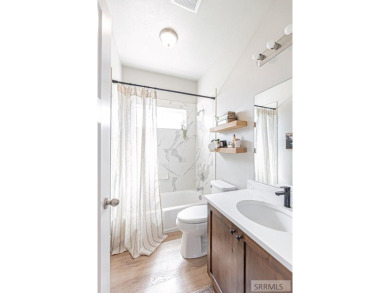 Discover this spacious 6-bedroom, 3-bathroom home nestled in the on Teton Lakes Golf Courses in Idaho - for sale on GolfHomes.com, golf home, golf lot
