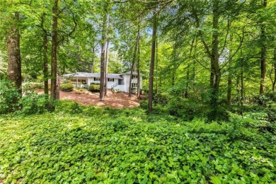 Nestled on a large + acre serene, corner lot in the highly on Bobby Jones Golf Club in Georgia - for sale on GolfHomes.com, golf home, golf lot