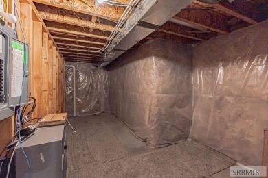 Discover this spacious 6-bedroom, 3-bathroom home nestled in the on Teton Lakes Golf Courses in Idaho - for sale on GolfHomes.com, golf home, golf lot