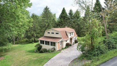 Here is a lovely 3 bedroom, 2 full bath, colonial style home on Mark Twain Golf Course in New York - for sale on GolfHomes.com, golf home, golf lot