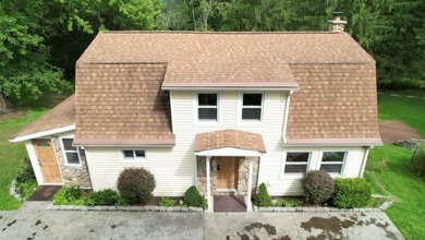 Here is a lovely 3 bedroom, 2 full bath, colonial style home on Mark Twain Golf Course in New York - for sale on GolfHomes.com, golf home, golf lot