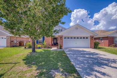 Welcome home to this beautifully updated Gulf Breeze gem, tucked on Tiger Point Golf and Country Club in Florida - for sale on GolfHomes.com, golf home, golf lot